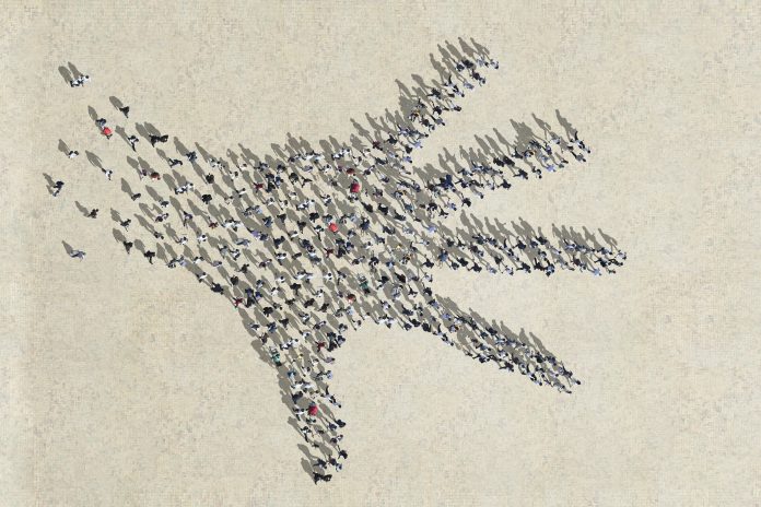 Big palm made out of walking people