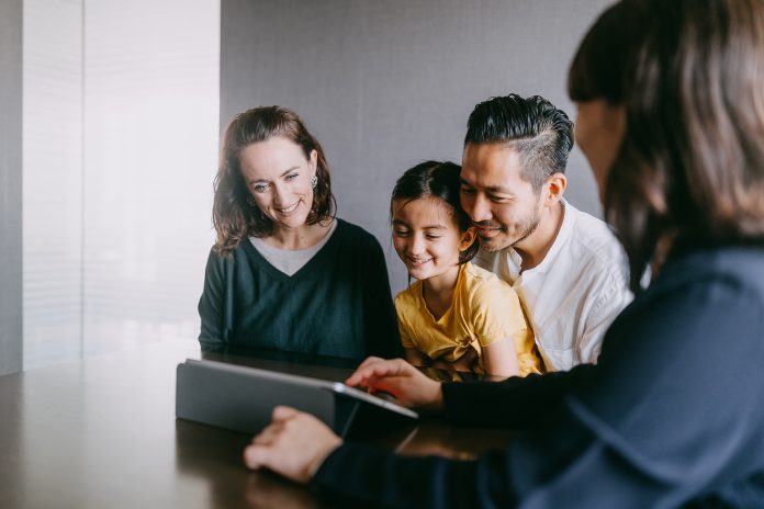 Family consulting with real estate agent